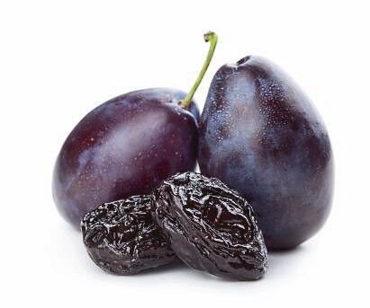 Dried_and_fresh_plums_isolated_on_white_background